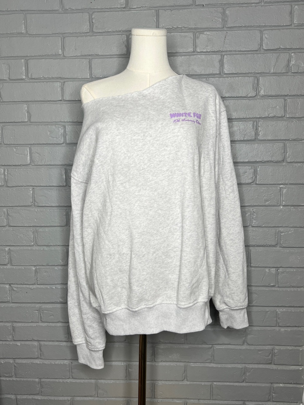 White Fox 10th Anniversary Off-Shoulder Light Gray Sweatshirt with Lilac Logo